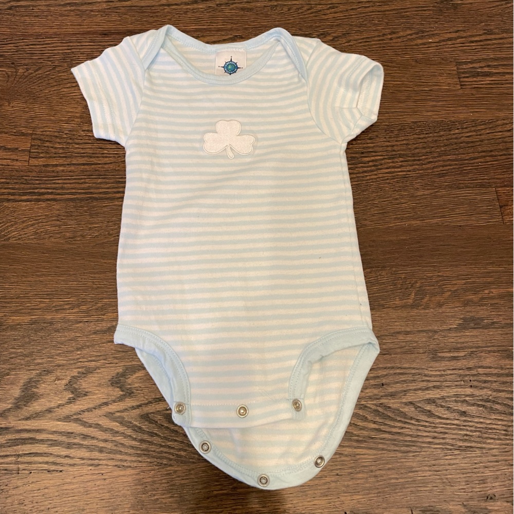 Short sleeved light blue and white striped onesie with embroidered shamrock